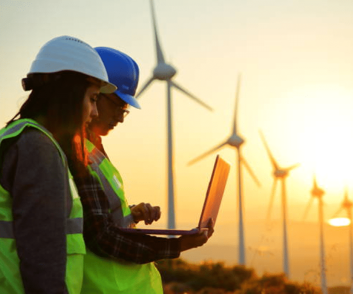 Two people in wind turbine field